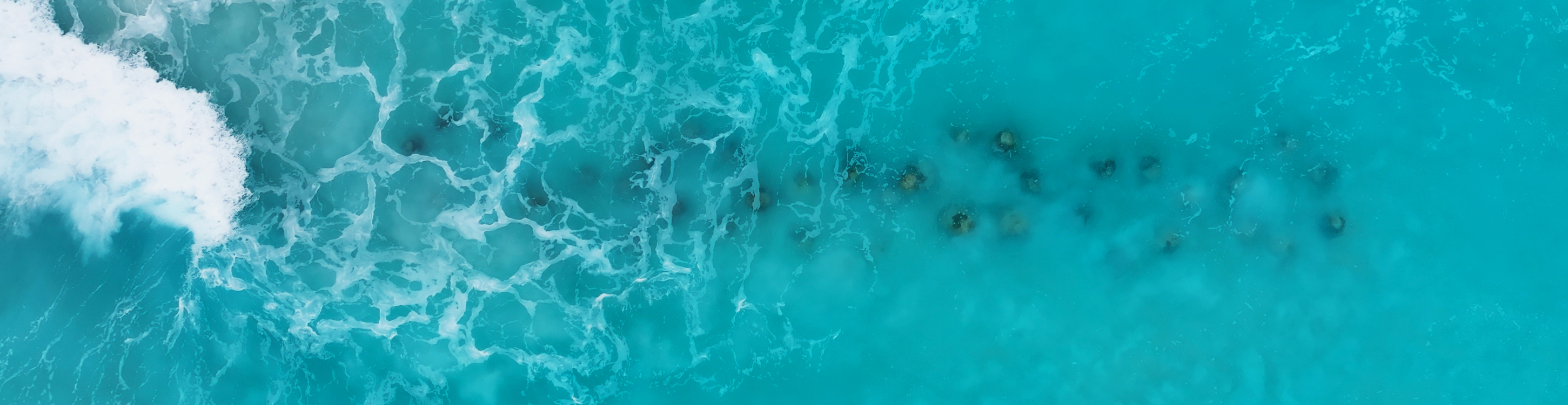 Aerial view of coastal waters with underwater structures